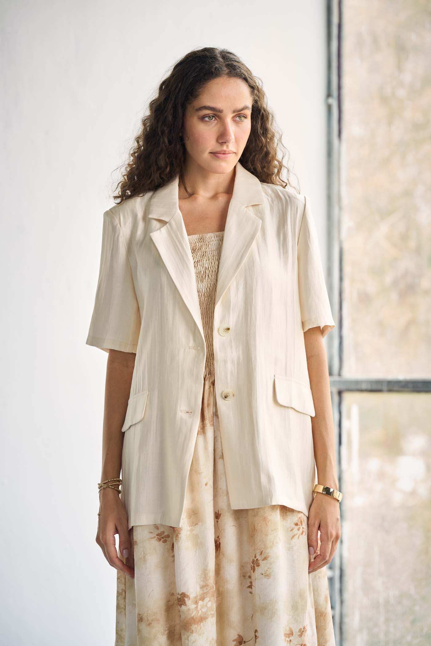 Ivory-tone blazer with notched lapels