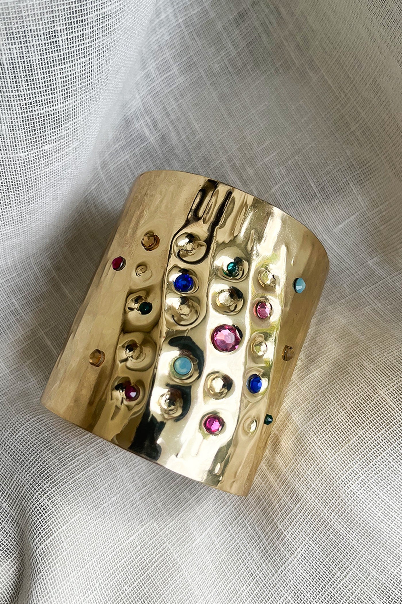 Golden multicolor studed hand cuff