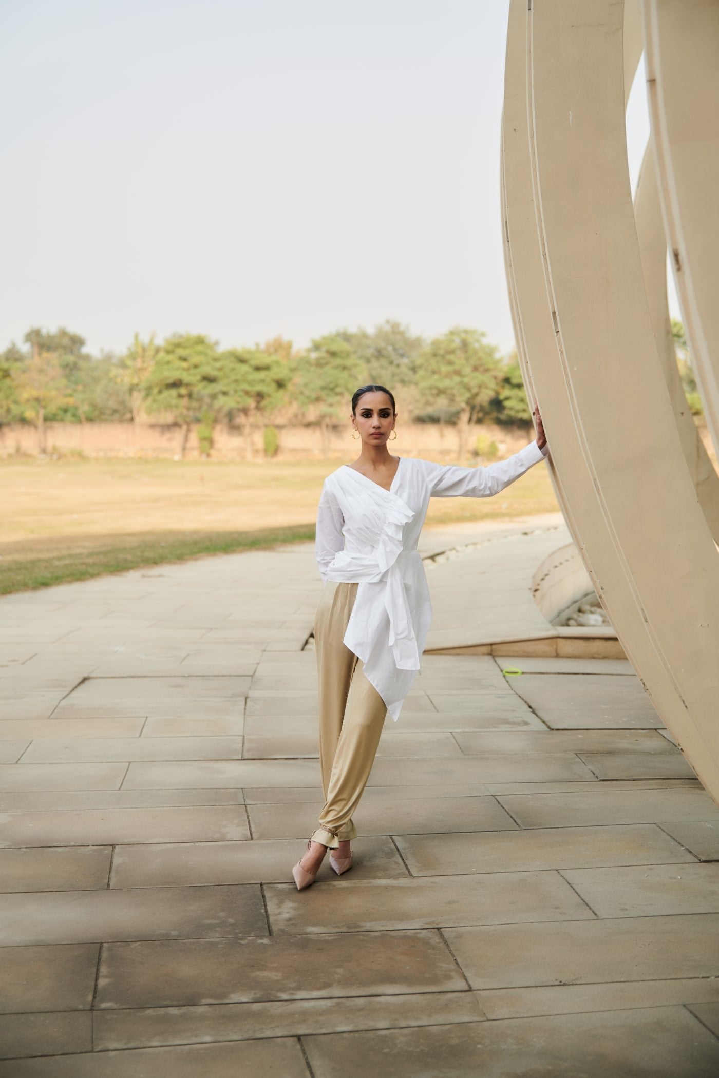 White Asymmetrical Draped Top With Golden Pants