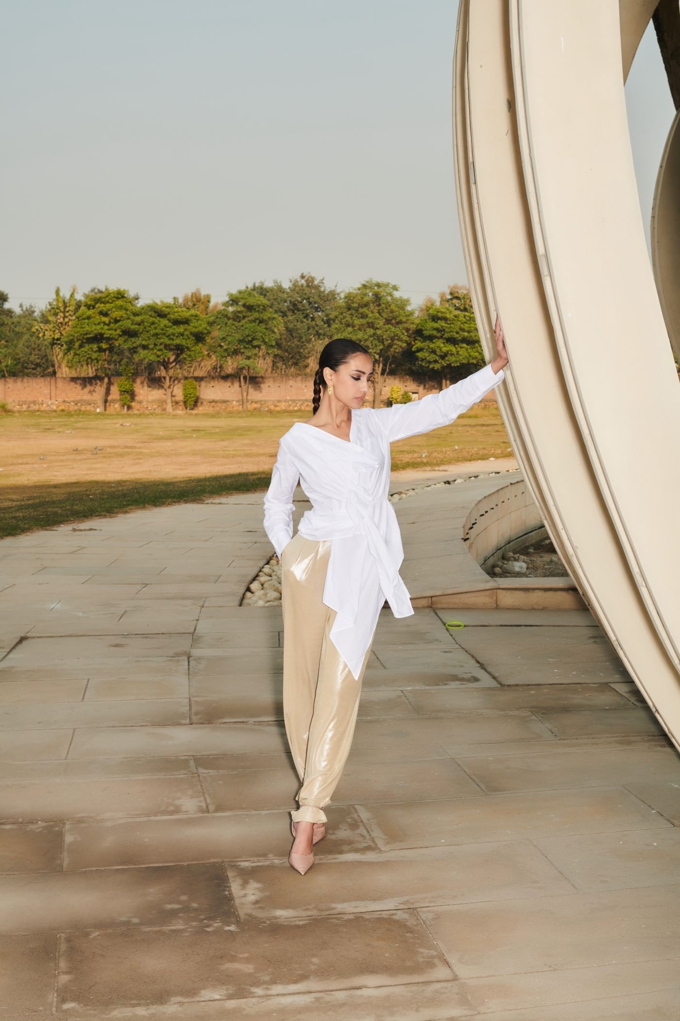 White Asymmetrical Draped Top With Golden Pants