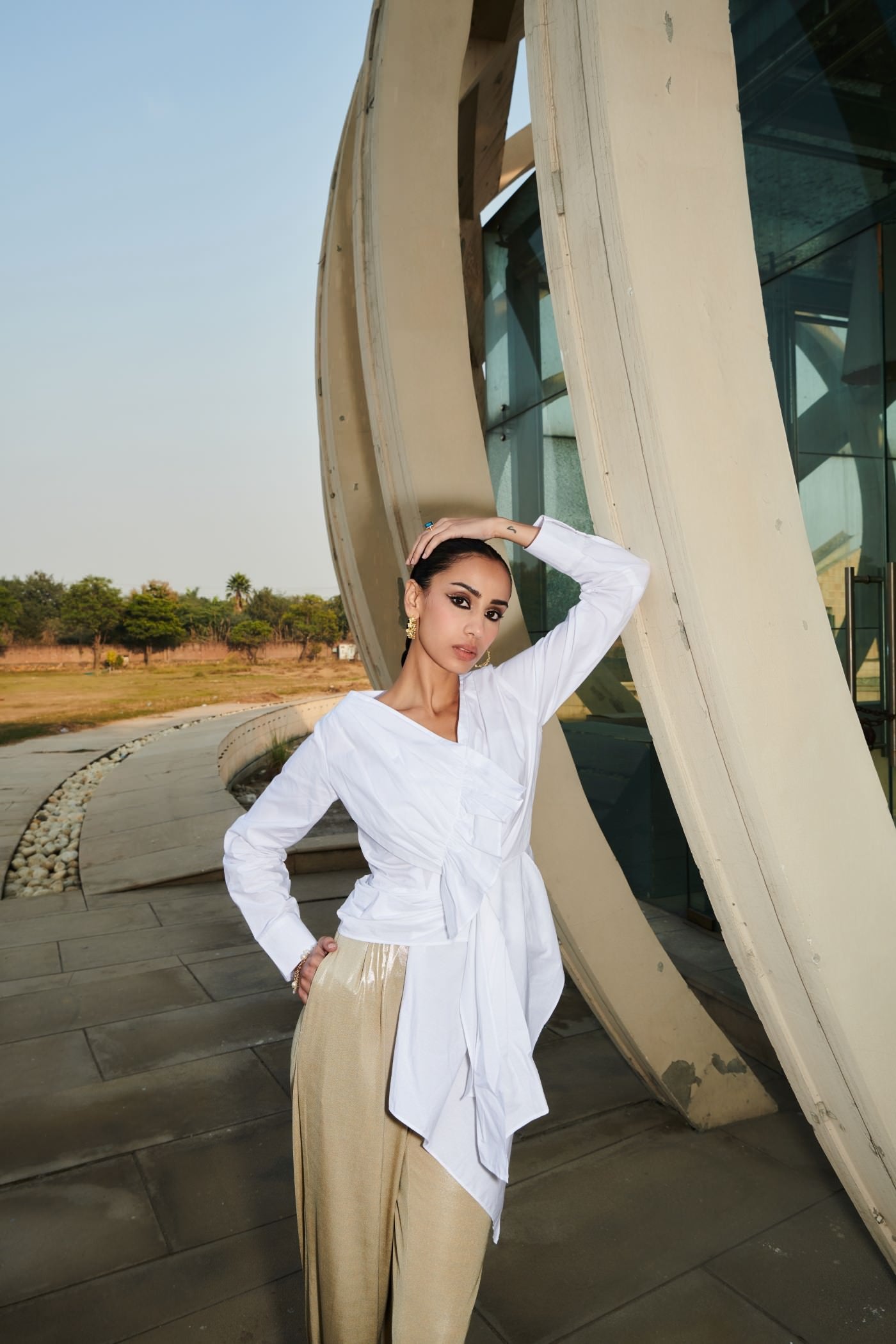 White Asymmetrical Draped Top With Golden Pants