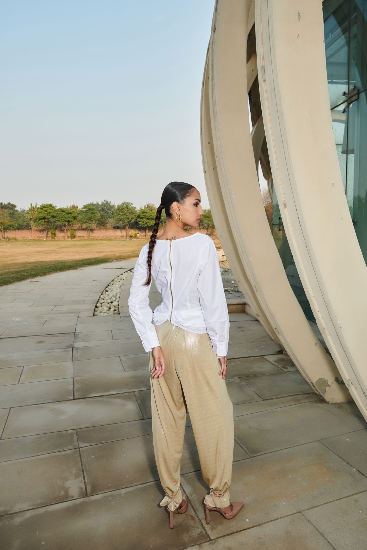 White Asymmetrical Draped Top With Golden Pants