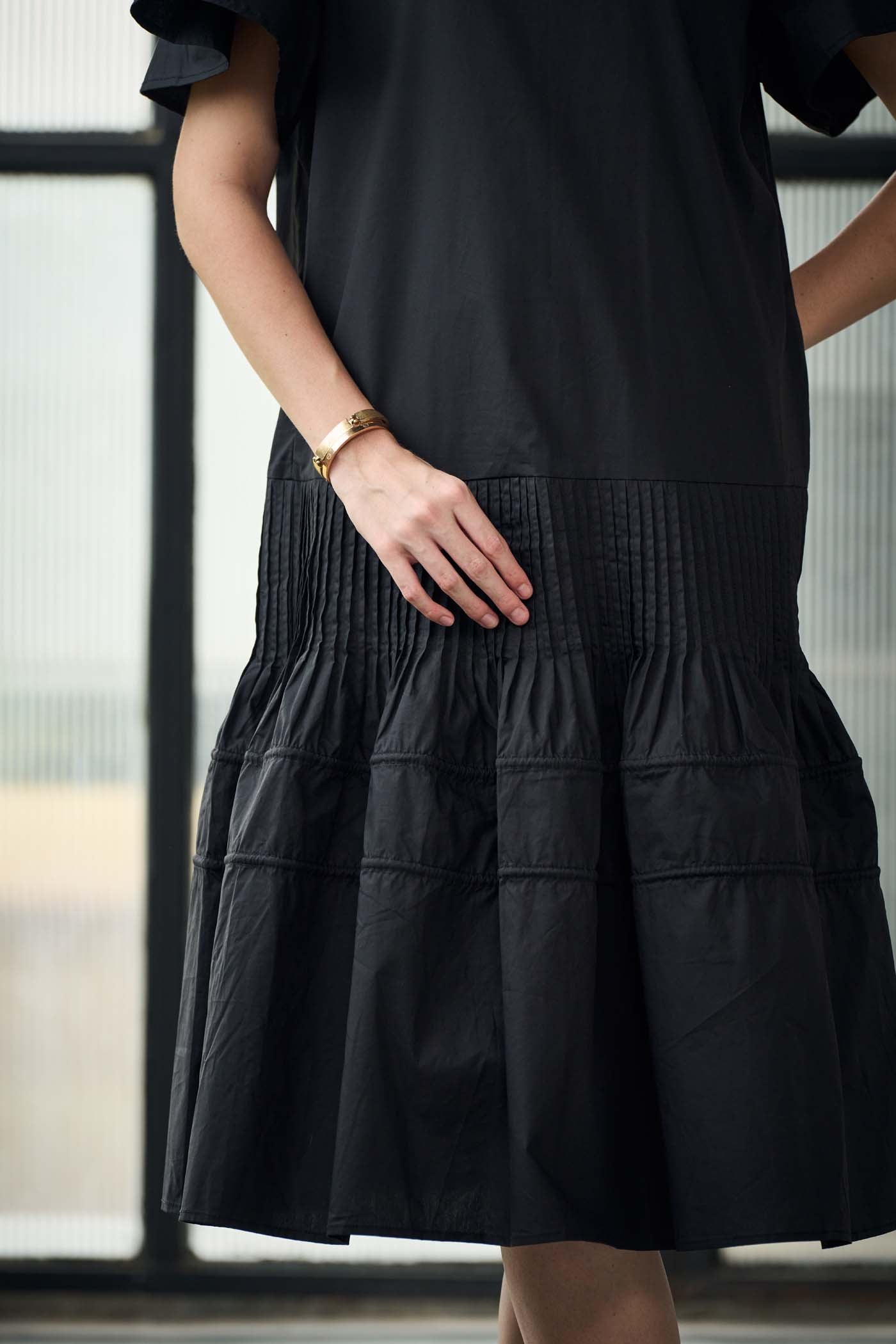 Black smocked ruffle dress